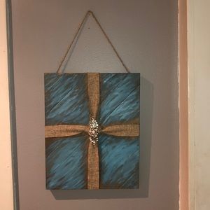Handmade wooden painting with decorative ribbon